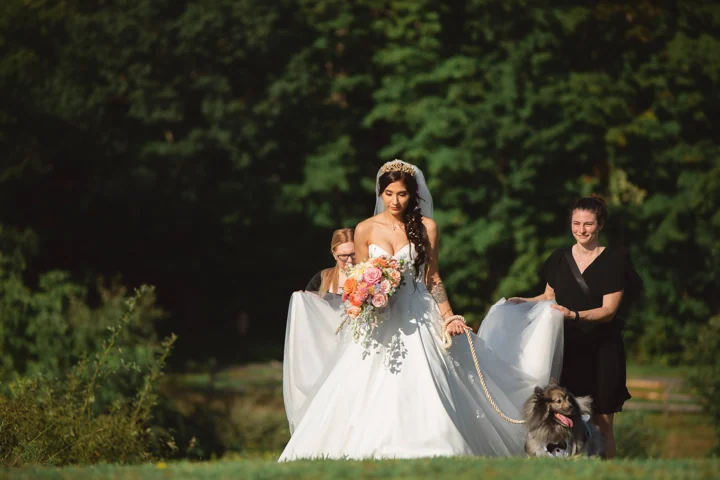 Serena helping a bride with her dress on her wedding day